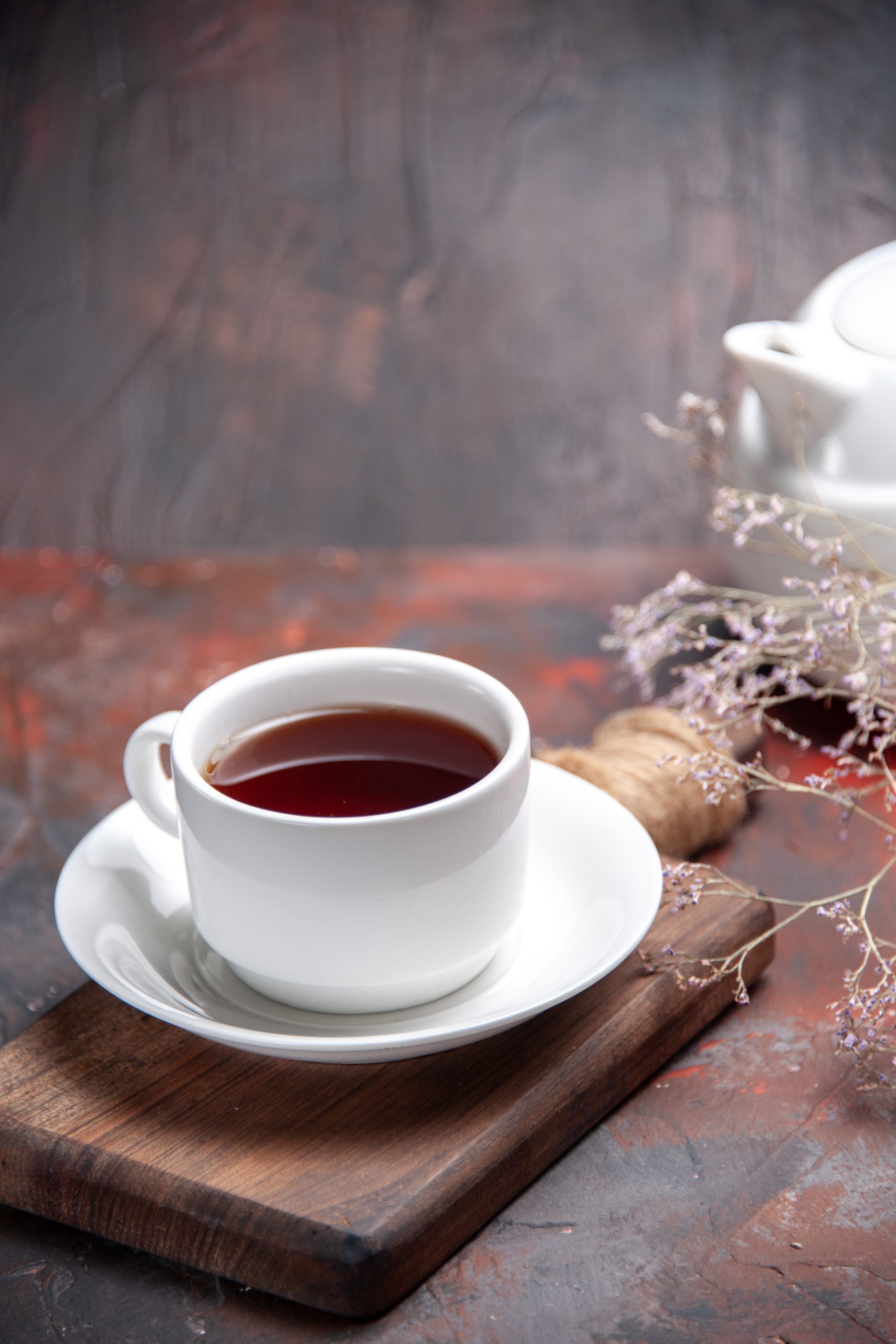 front-view-cup-tea-dark-table-dark-biscuit